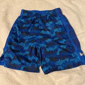Blue patterned Nike sport shorts. Boys size small